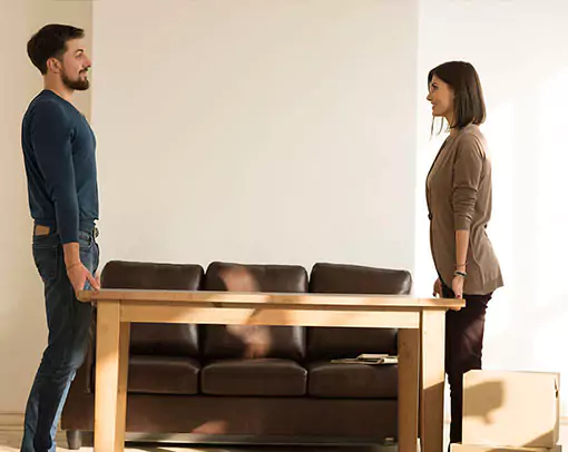 before-your-hardwood-installation Couple moving table | Legend Flooring