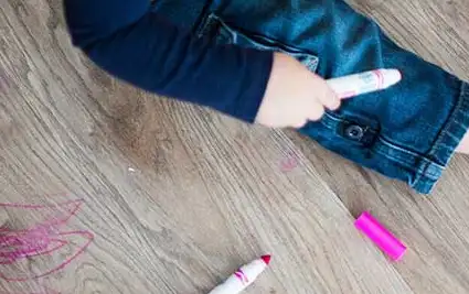 Kid playing with color pencil | Legend Flooring